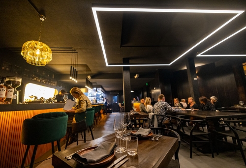 Dimly-lit interior of The Arsonist Manly