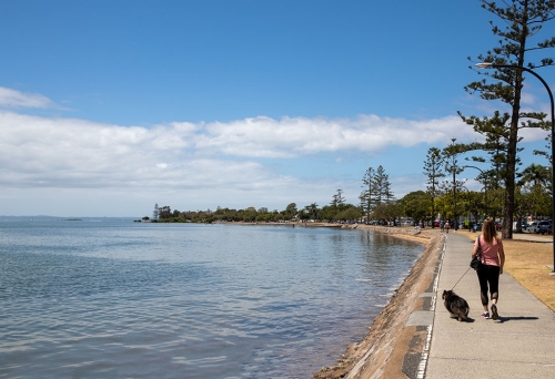 Woman and dog walking Wynnum to Manly 