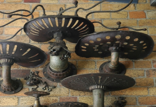 Frogs Hollow sculpures on brick wall