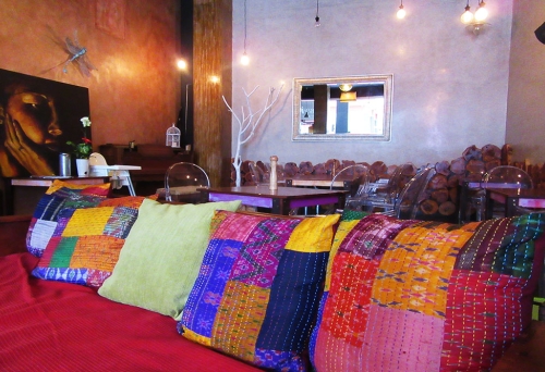 Colourful cushions on a lounge chair at Gabi Cafe Woolloongabba