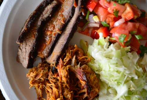 Meat and salad on a plate at Bluegrass BBQ Smokehouse at Hudson Corner