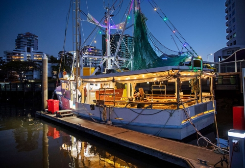The Prawnster ex-fishing trawler afloat in Brisbane River