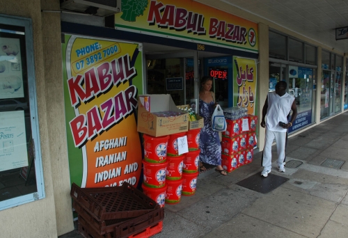 Woman walking out of Kabul Bazar, Moorooka