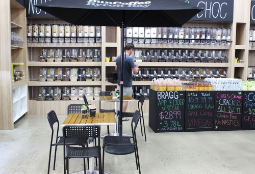 Person selecting bulk foods at Kiah Organic Wholefoods Warehouse Mt Gravatt