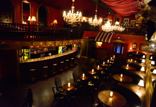 Seating booths, bar and hall inside Lefty’s Old Time Music Hall bar