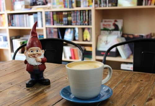 Gnome and coffee cup on table at Little Gnome Wynnum