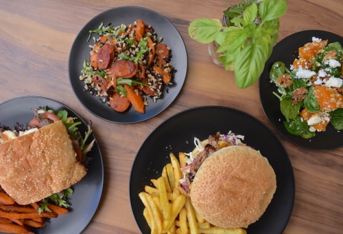 Food on four plates at Mad Kitchen & Co Bowen Hills