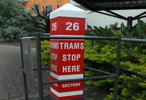 Tram Stop no 26 red and while poll in Coorparoo