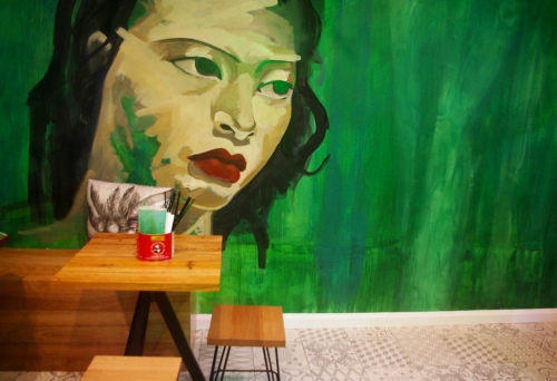 Mural on wall in front of table and chair inside Asian Kitchen Tingalpa