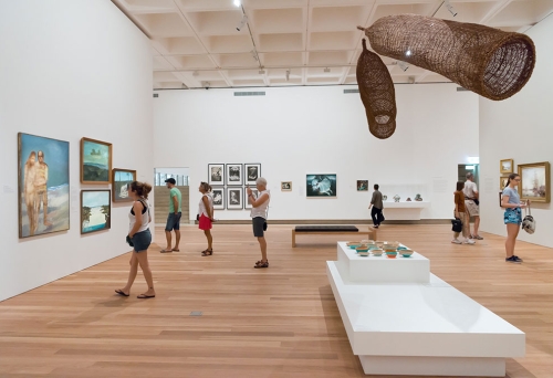 People looking at art on the walls of Queensland Art Gallery, South Brisbane