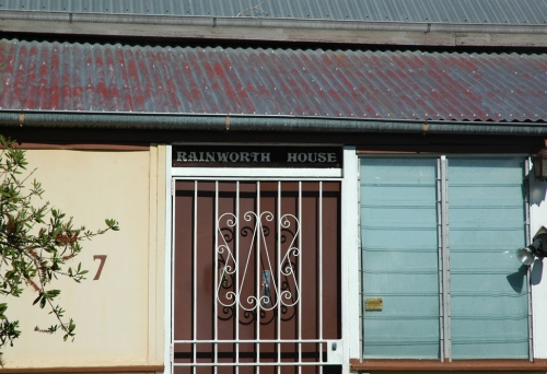 Front door and sign on Rainworth House Bardon