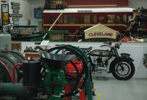 Old machines, motorbike and horse carriage inside Redlands Museum in Cleveland.