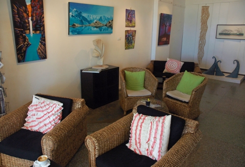 Seating and paintings and sculptures inside Valori espresso Lounge