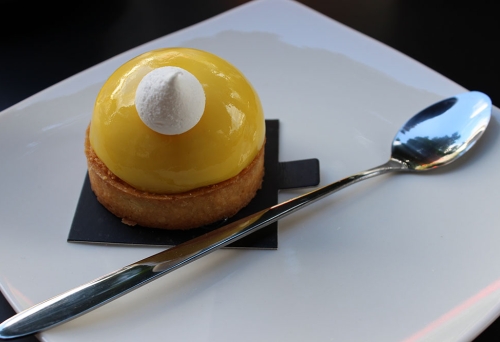 Passionfruit Almond Tart with a miniature meringue on top at The Whisk Fine Patisserie Upper Mt Gravatt 