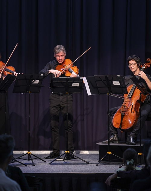 ARCO Orchestra performing on stage 
