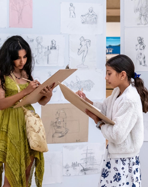 Two people drawing