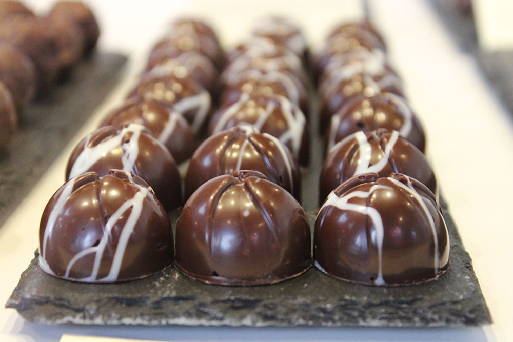 Three rows of little chocolates inside 31 Degrees Custom Chocolates Woolloongabba