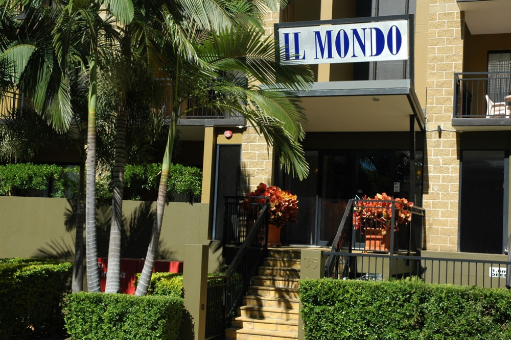 Entrance and sign on building of Il Mondo Boutique Hotel Kangaroo Point