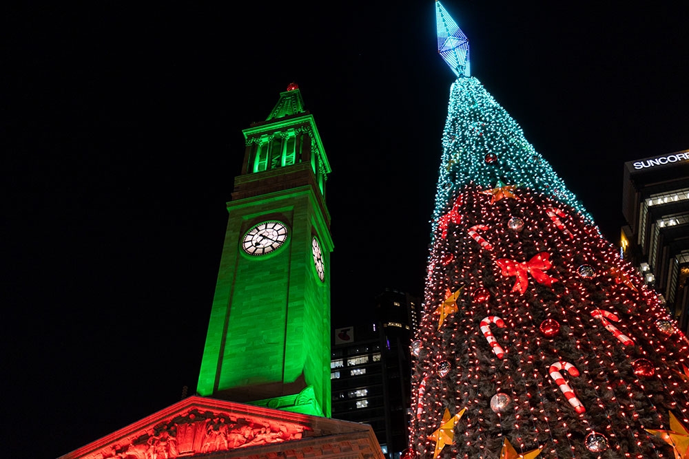lit up clocktower and Christmas tree Brisbane