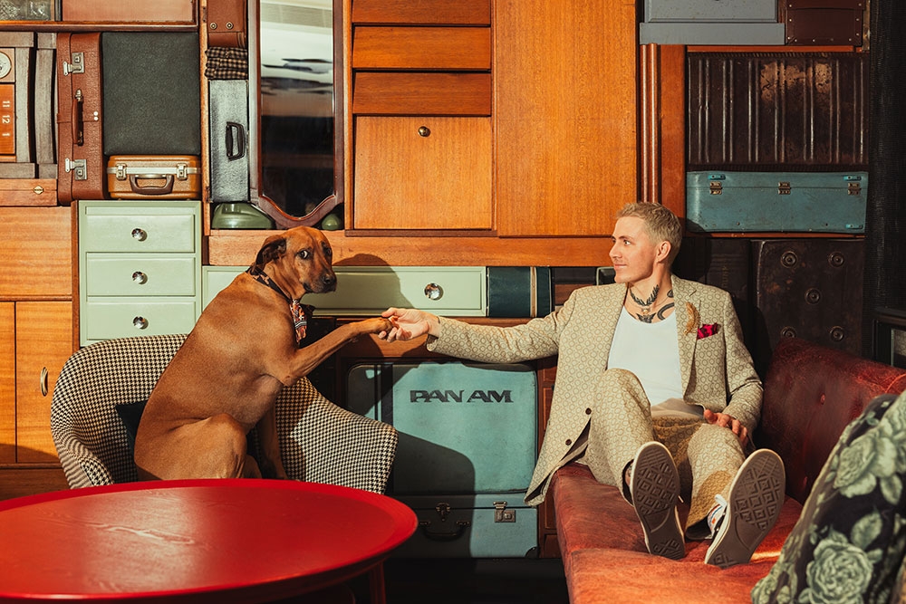 Man in room with dog at QT Hotel Gold Coast