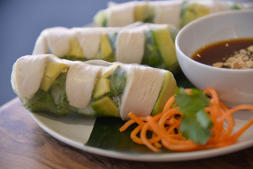 Three rice paper rolls and sauce on a plate at District 1 Fortitude Valley