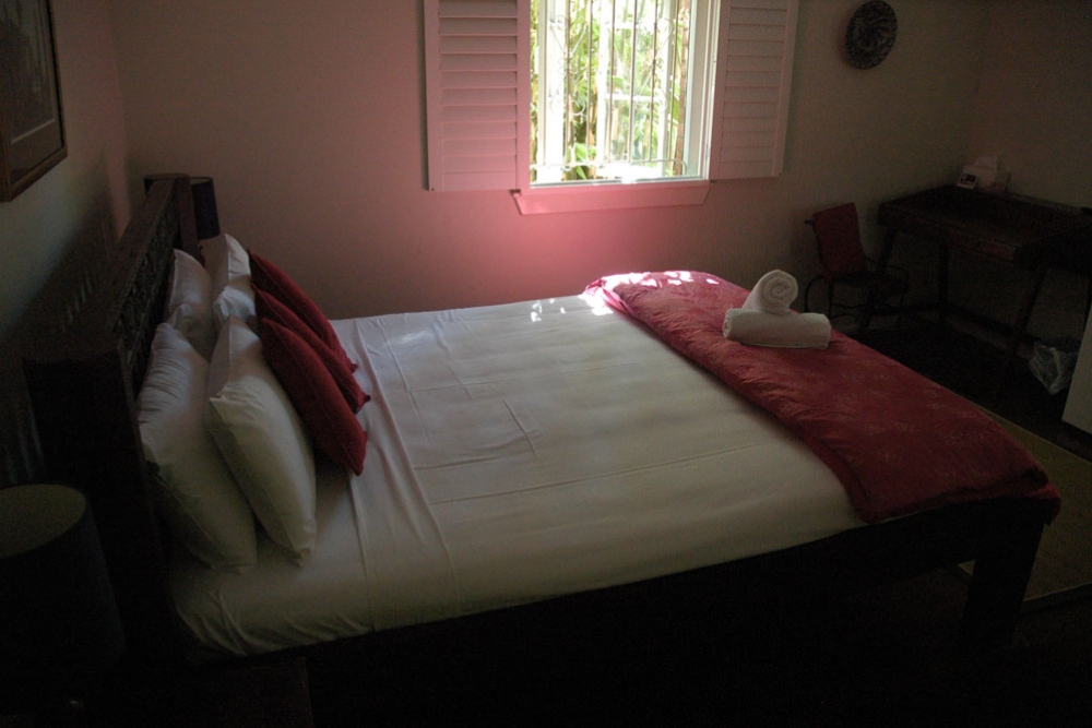 Double bed inside Edward Lodge in Brisbane's New Farm