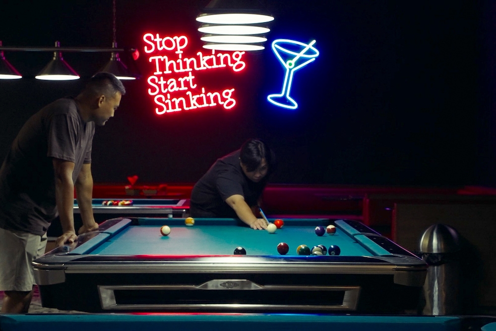 Two men playing pool at Rack City Pool Hall & Bar 