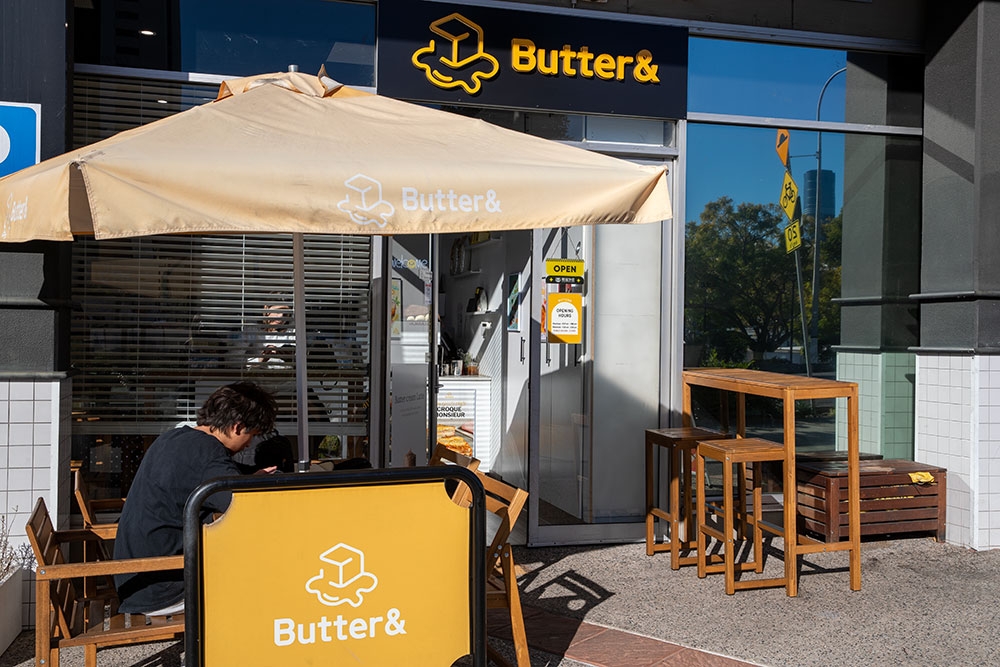 Person sitting outside Butter & 