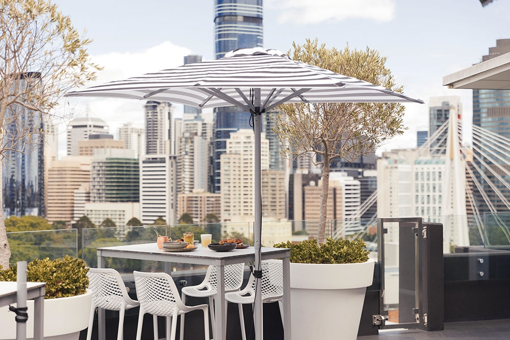Table and unbrella on terrace at Eagles Nest Kangaroo Point