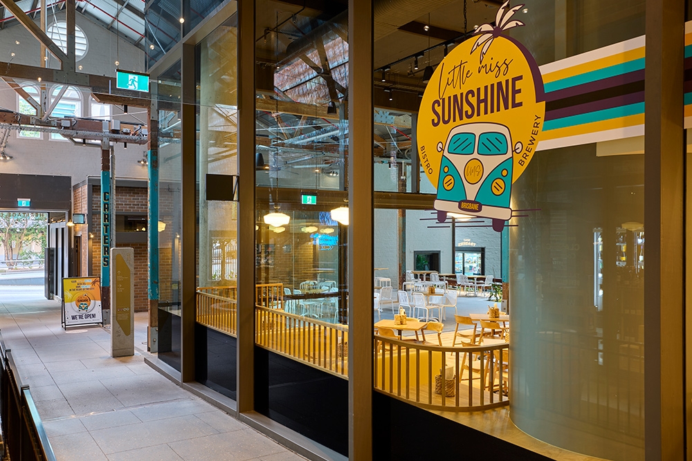 Front window with signage at Little Miss Sunshine Brisbane CBD