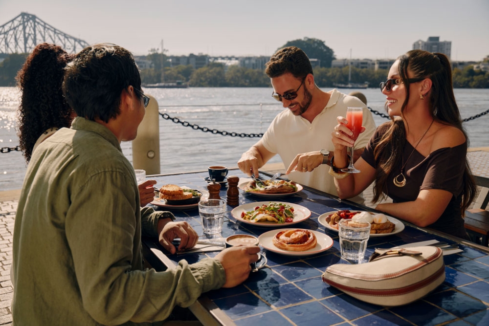 People having brunch by the river