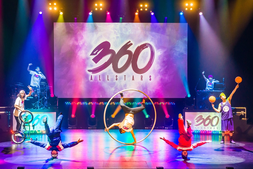 Performers on stage doing BMX, basketball, breakdancing, beatboxing, acrobatics & drumming at 360 ALLSTARS show at the Redland Performing Arts Centre