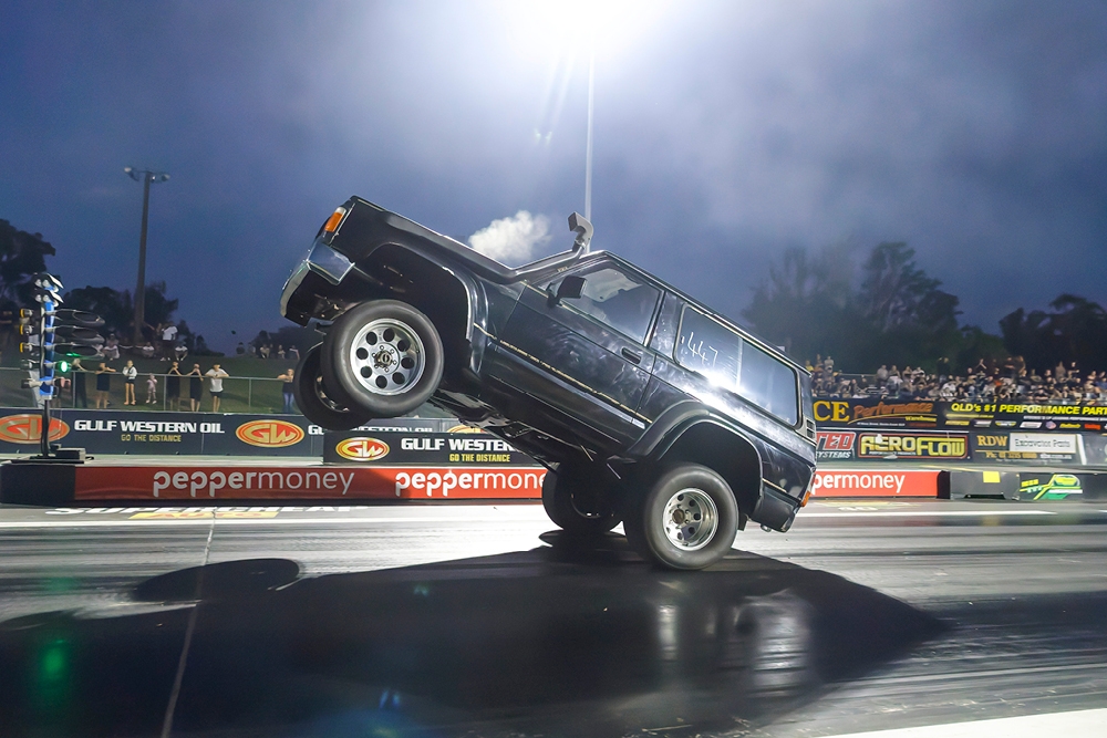 Big car doing a wheelie at Planes, Trains And Autos 2026