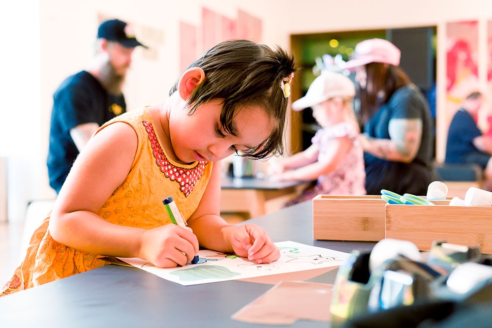 Child doing activities at Museum of Brisbane