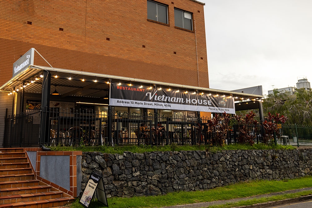 Exterior of Vietnam House Milton showing outside seating