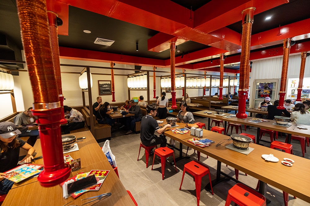 People seated at tables inside Yakiniku Hachi Brisbane CBD