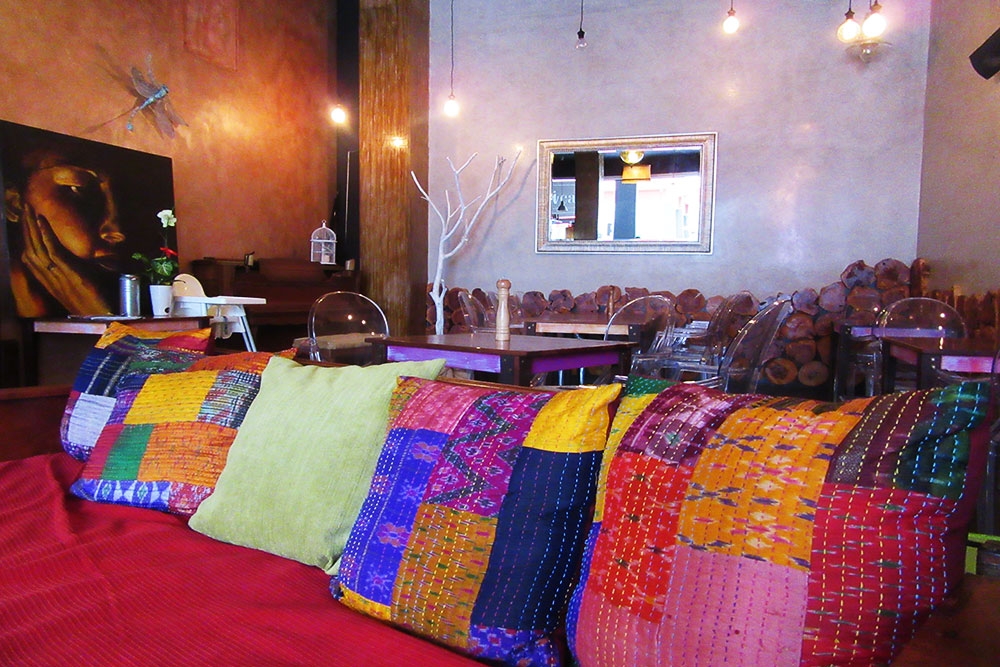 Colourful cushions on a lounge chair at Gabi Cafe Woolloongabba