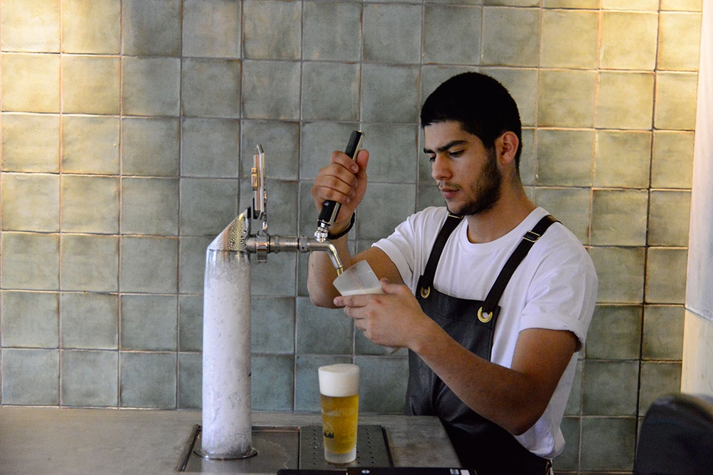 Bar tender drawing a glass of draft beer Gerard’s Bar & Charcuterie Fortitude Valley