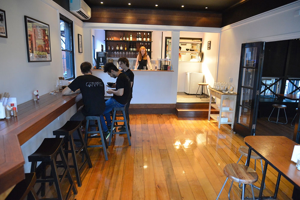 Men sitting on stools at Hai-Hai Ramen Paddington