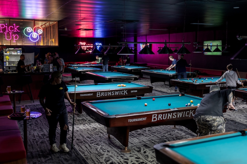 People playing pool inside Rack City Pool Hall & Bar