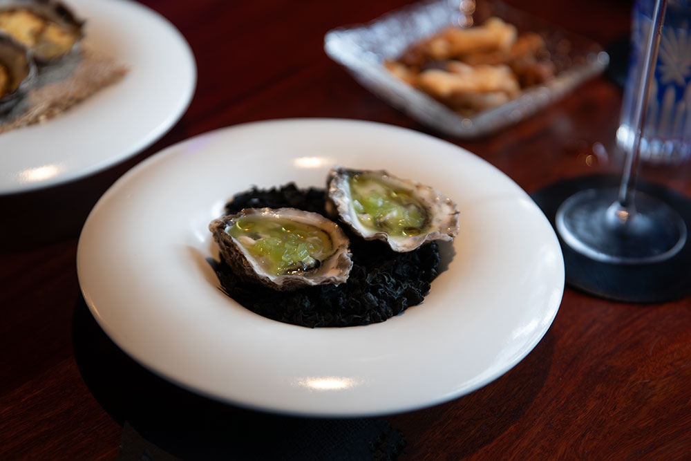 oysters on plate at +81 Aziome Bar