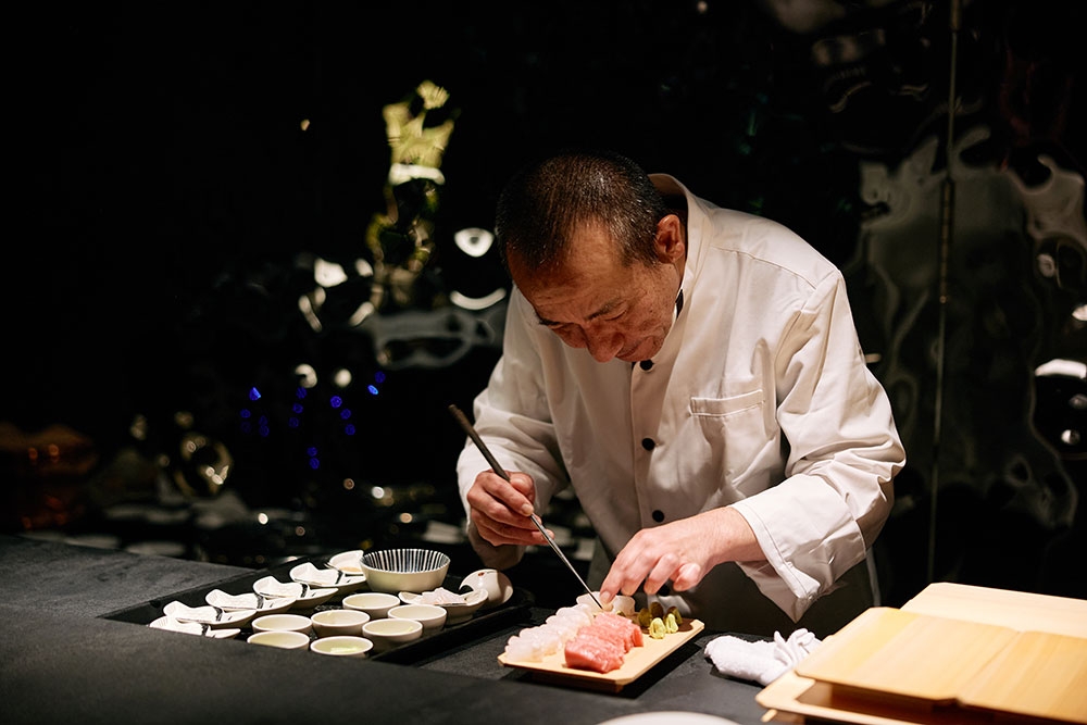 chef preparing sushi at +81 Sushi Kappo West End