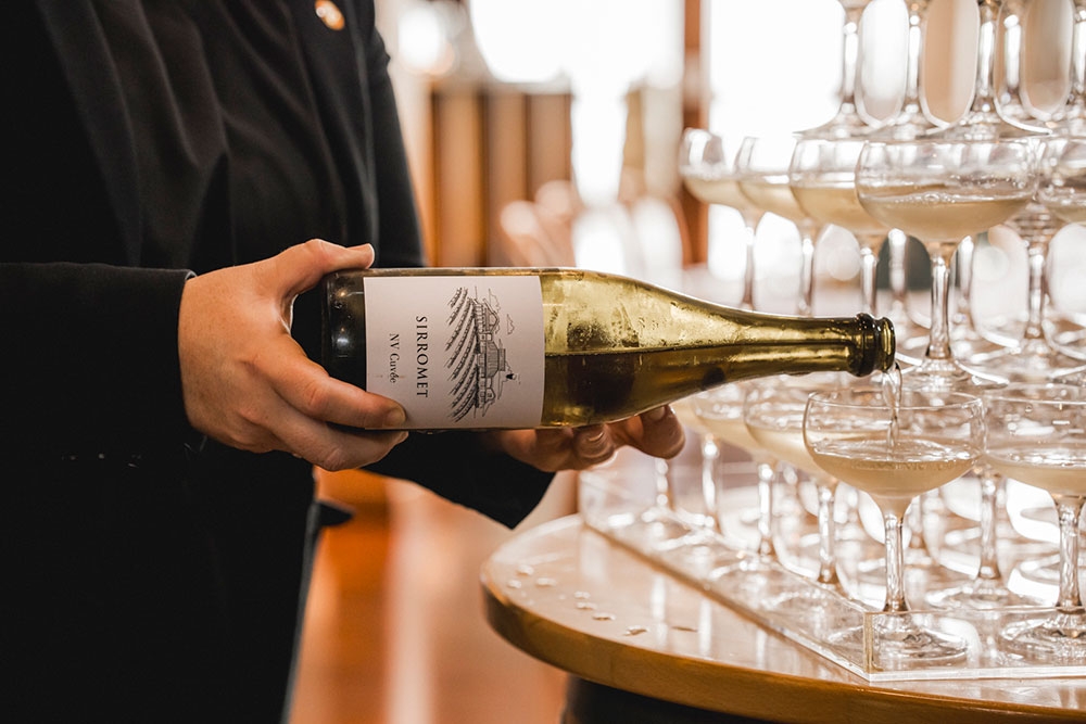 Waiter pouring wine at Sirromet