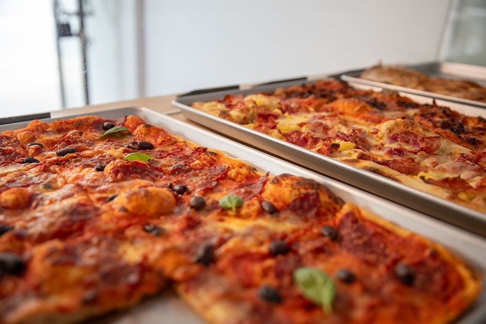 Pizza By the Slice at 075 Pinsa Romana
