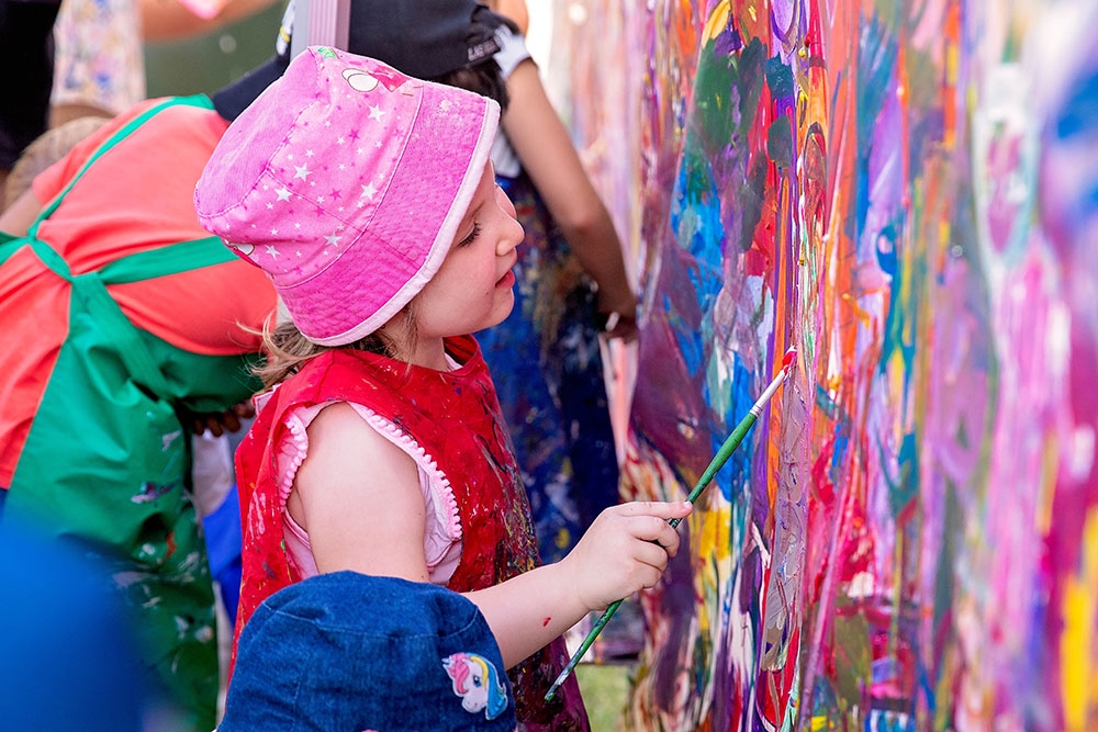 Children painting wall ImagiNation Children's Festival