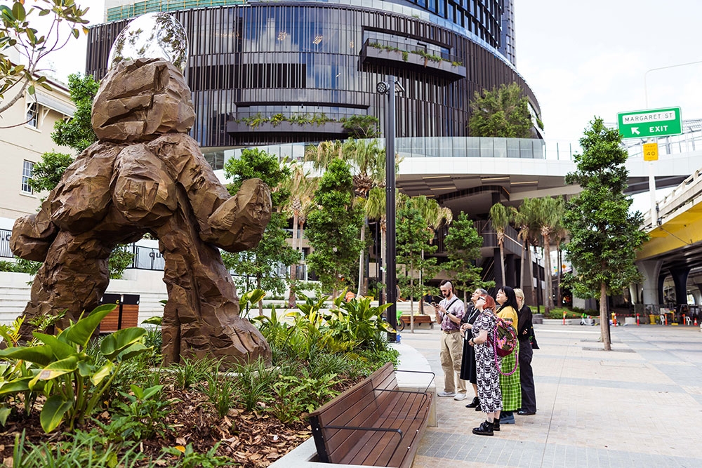 People looking at sculpture Queens Wharf Precinct Public Art Tour
