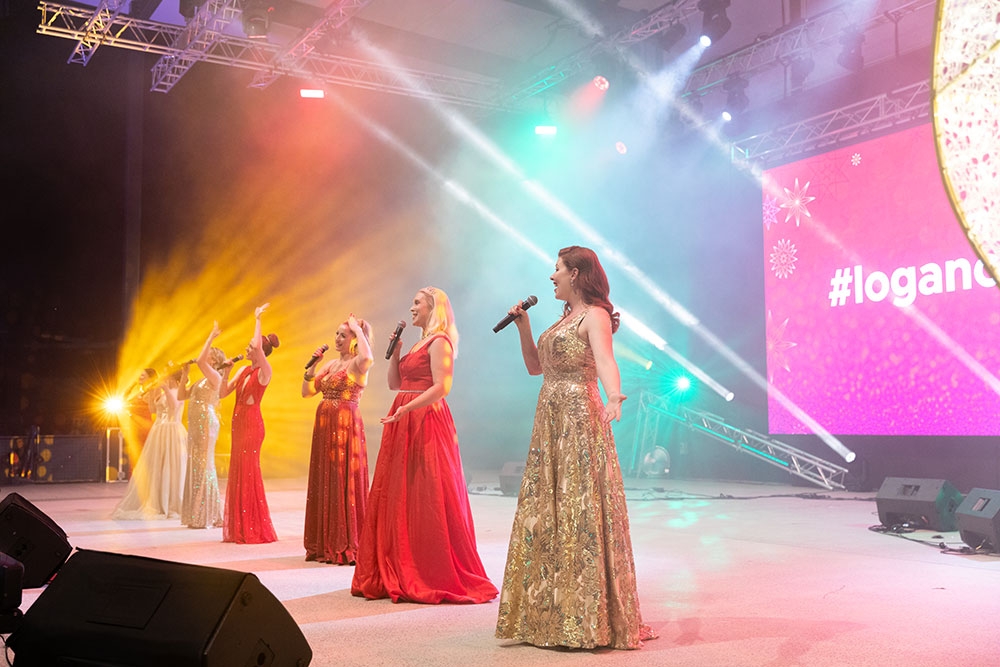 Singers on stage City of Logan Christmas Carols