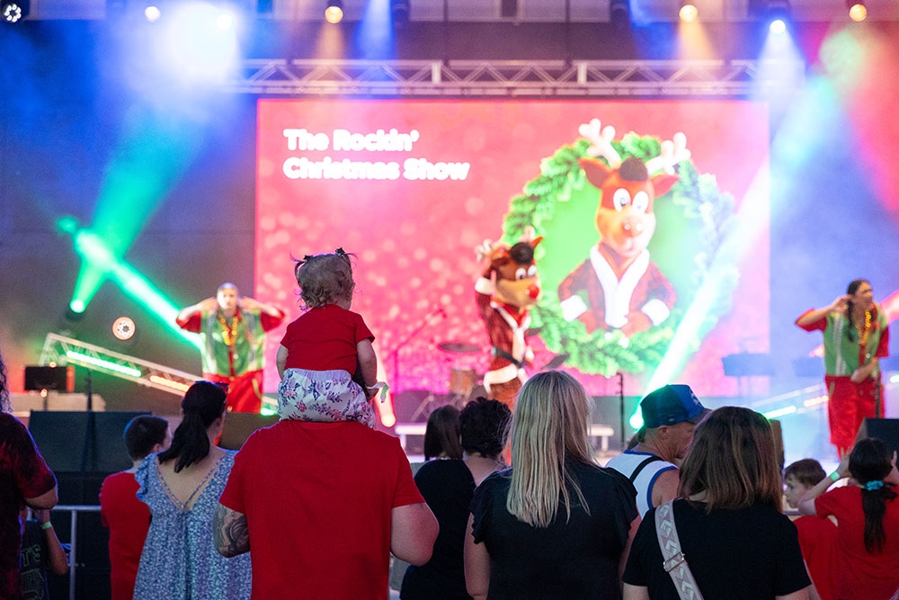 Performers on stage City of Logan Christmas Carols