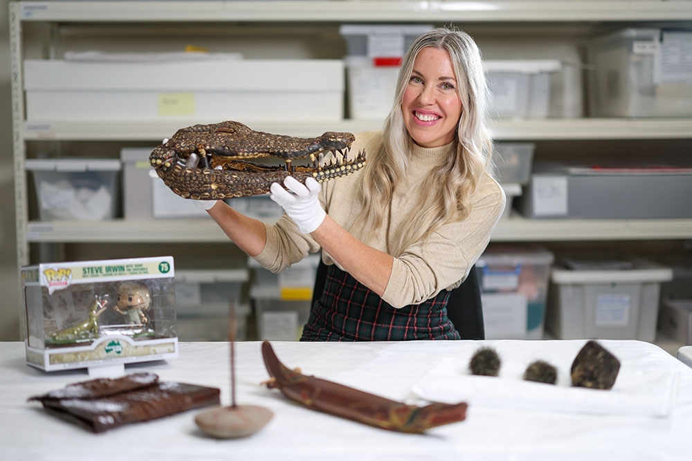 Scientist with crocodile skeleton