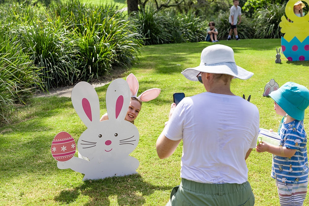 Man taking photos at the Easter Weekend at Roma Street Parkland 
